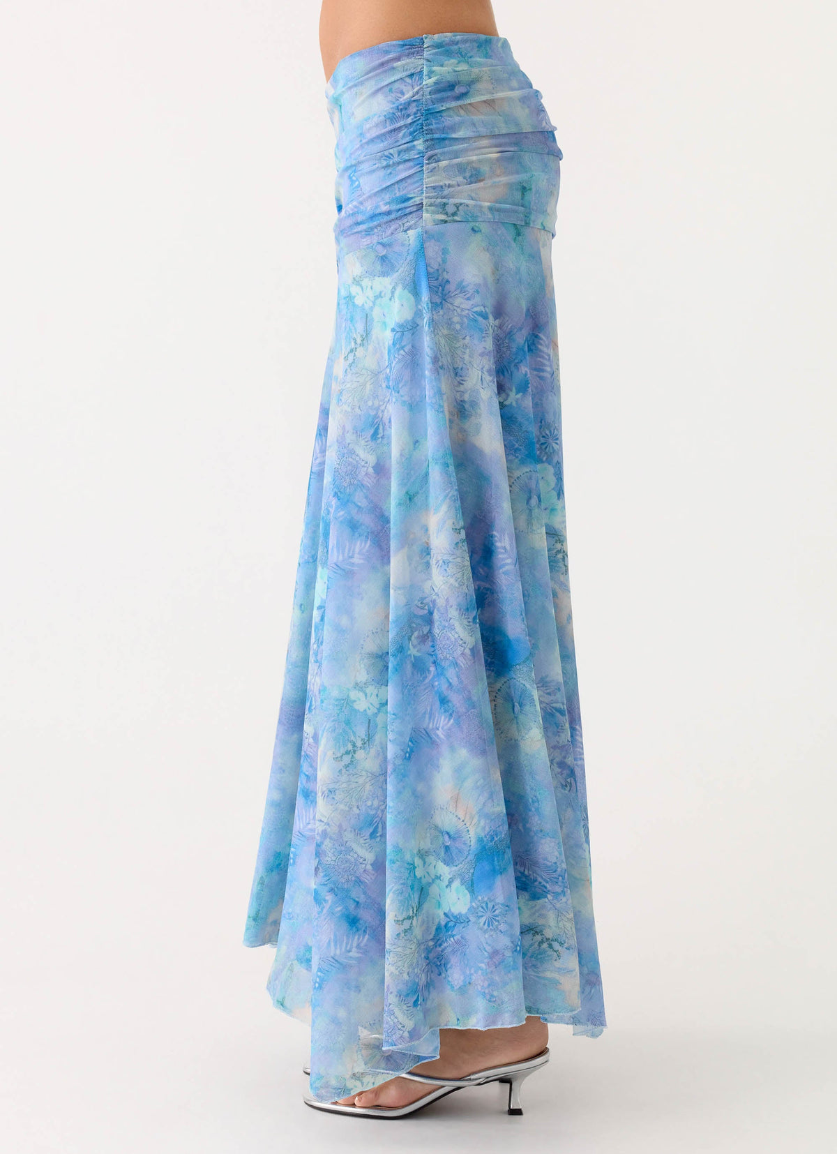 Side view of the aqua paisley ruched maxi skirt showing the gathered low-rise waist and flared hem