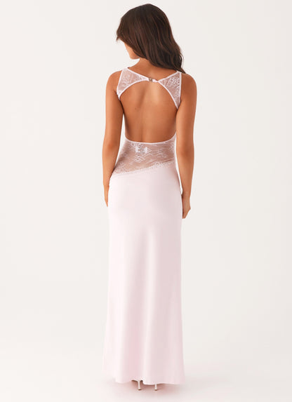 Back view of the pink maxi dress showing the lace-trimmed open back cut-out