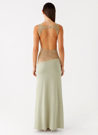 Back view of the sage maxi dress showing the lace-trimmed open back cut-out