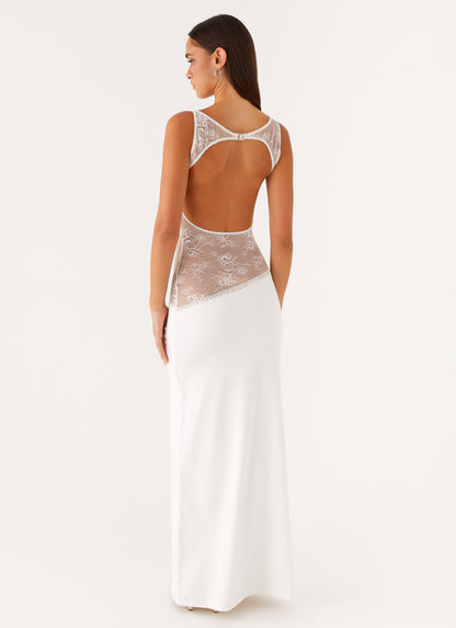 Back view of the white maxi dress showing the lace-trimmed open back cut-out