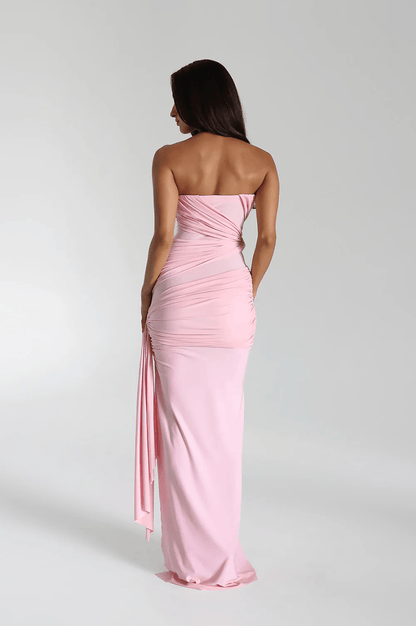 Back view of the blossom pink strapless maxi gown showing the draped bodice and long skirt