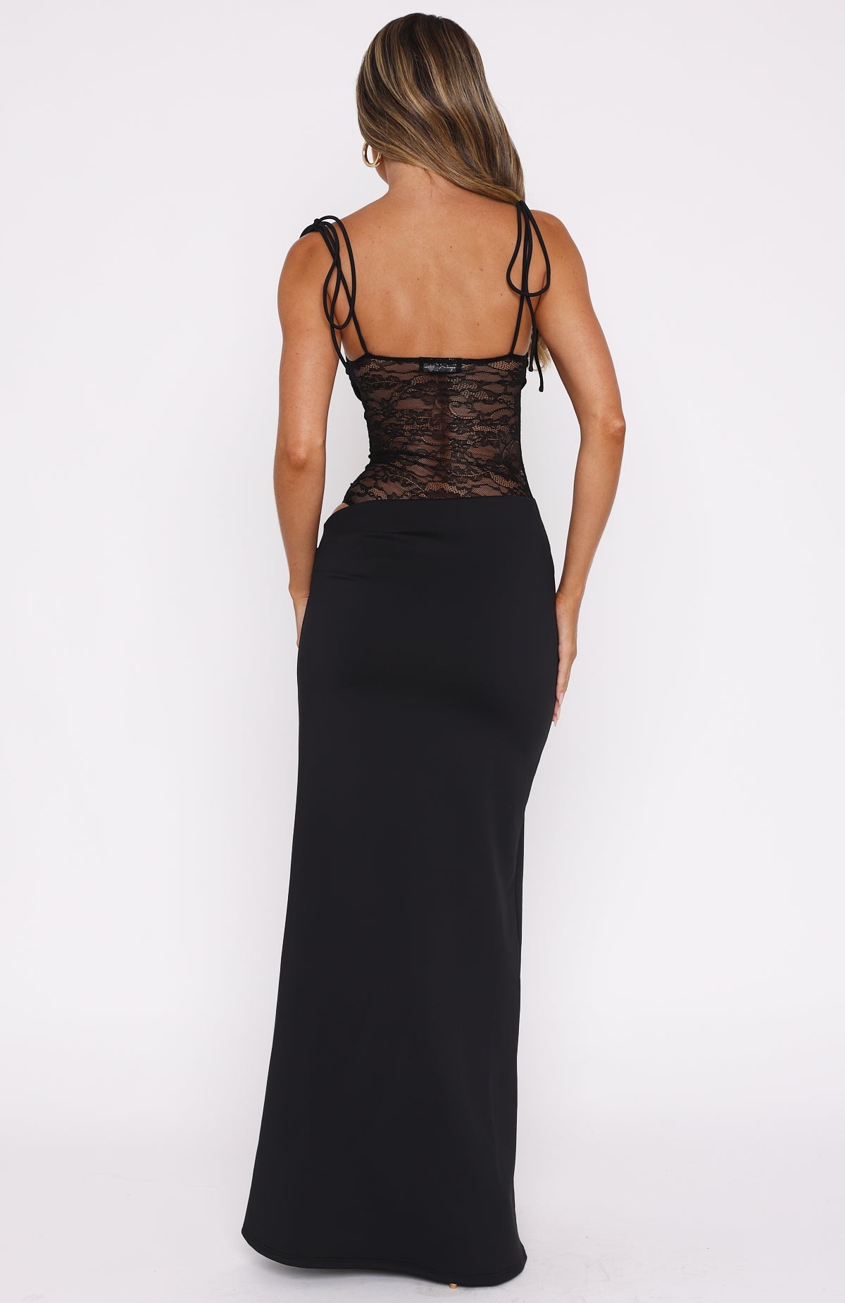 Back view of the black maxi dress showing the tie straps and sheer lace bodice